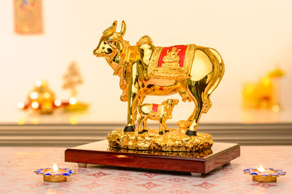 24K Gold Plated Kamdhenu Cow with Calf and Lakshmi Relief on Velvet with Textured Golden Base